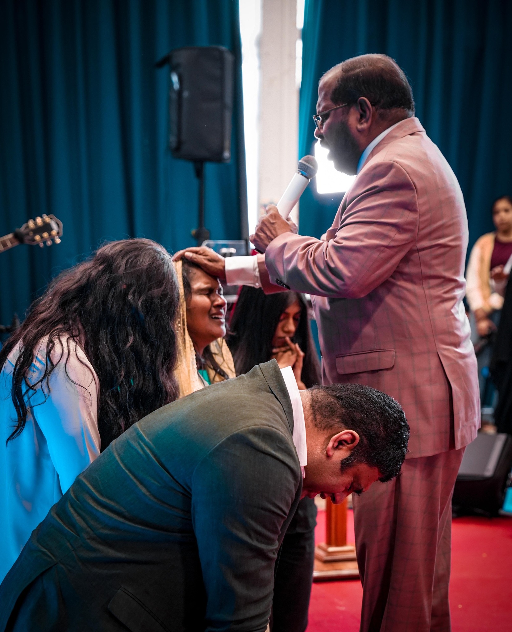 Pr. N Peter praying over Minister